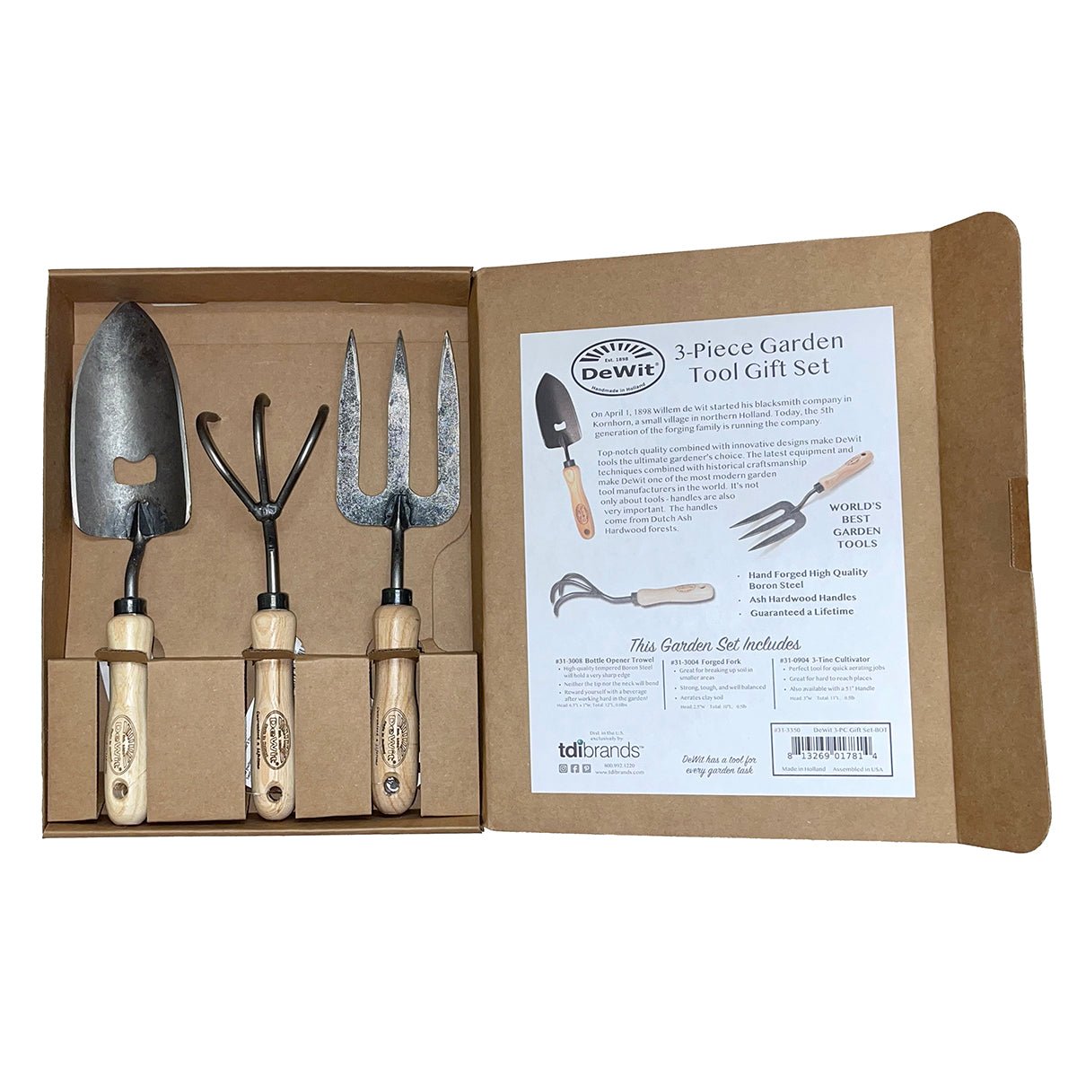 3 piece gardening gift set with trowel, cultivator and fork in a cardboard box on a white background 