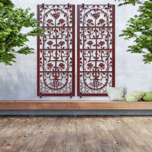 H Potter brand Two mahogany brown metal trellises with laser cut rose patterns, positioned vertically on a wall with a wooden floor and greenery in the background.