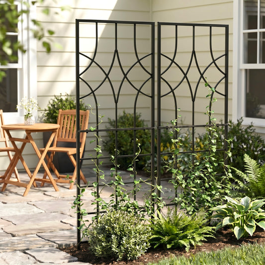 h potter set of 2 black iron garden trellises with plants on stone patio in backyard