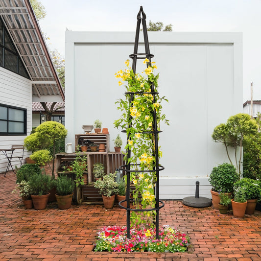 H Potter grand black 8 foot tall garden obelisk trellis supporting flowering vine in courtyard