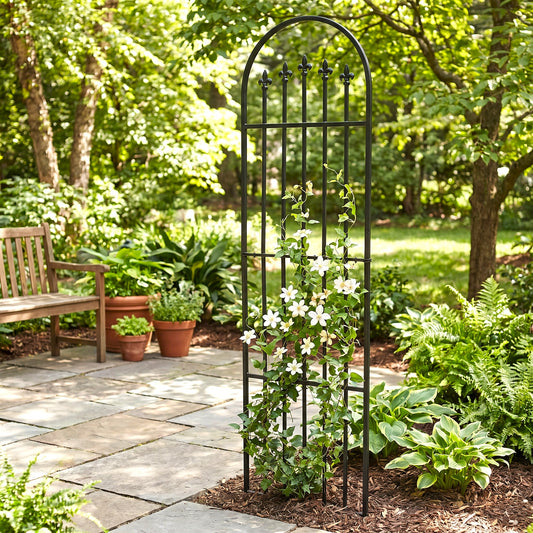 h potter black garden trellis in mulch on stone patio