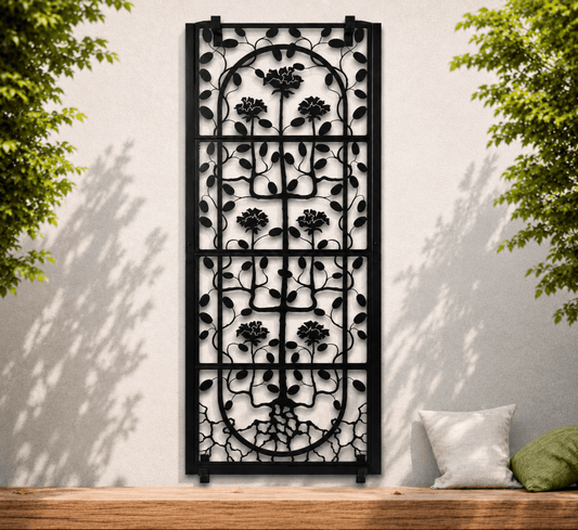 H Potter decorative black metal screen with floral patterns on a white wall with greenery.
