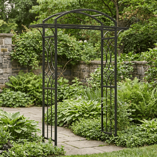 H Potter black metal garden archway in a lush garden setting with stone pathway and stone wall.