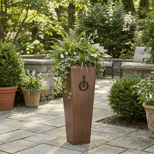 h potter 29 inch tall planter on stone patio with greenery