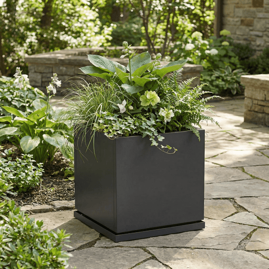 h potter Laurel planter 20 inch gray square with plants on a stone patio